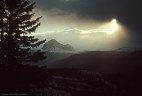A winter sun breaks out over Engineer Peak.